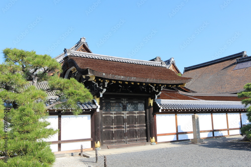 Shoin Gate in Nishi Hongwanji Temple, Kyoto, Japan (Japanese words on the stone statue mean 