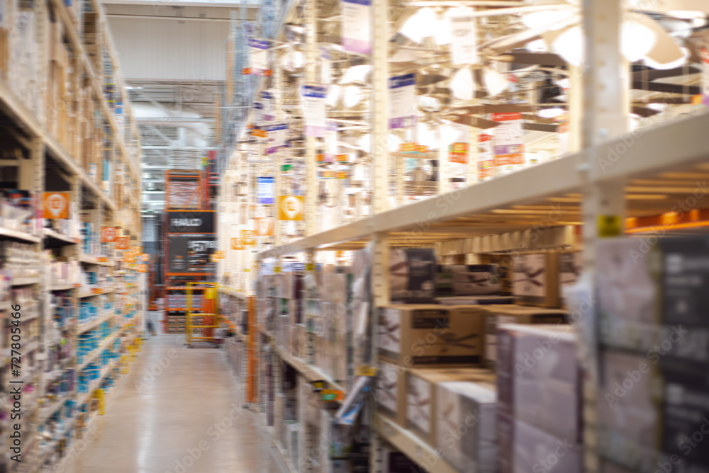 Blurred motion lights and ceiling fans on display at hardware home improvement store in Dallas, Texas, bokeh background, indoor outdoor air circulation, electric home appliance with price tags Blurred motion lights and ceiling fans on display at hardware home improvement store in Dallas, Texas, bokeh background, indoor outdoor air circulation, electric home appliance with price tags