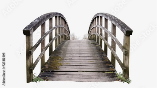 A picturesque wooden bridge spanning across a serene body of water. Suitable for nature and landscape themes