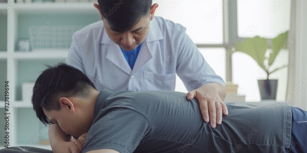 Obraz premium A man receiving a relaxing massage in a peaceful room. Suitable for spa, wellness, and self-care concepts
