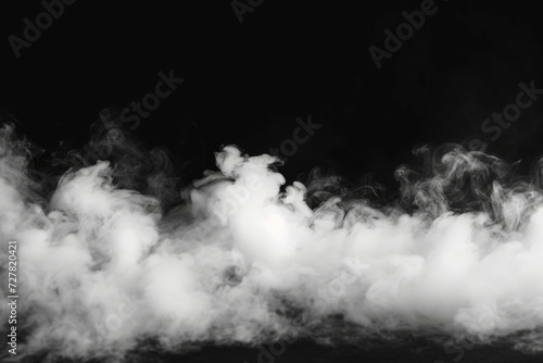 A captivating black and white photo capturing smoke rising from the ground. Perfect for adding a mysterious and atmospheric touch to various creative projects