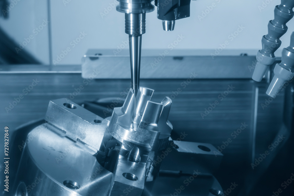 The 5-axis CNC milling machine cutting the automotive part with solid ball end mill tool. The 5-axis CNC milling machine cutting the automotive part with solid ball end mill tool.