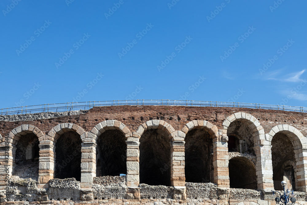 View of the Verona Arena arches and blue sky in a beautiful sunny day; Verona, Veneto, Italy