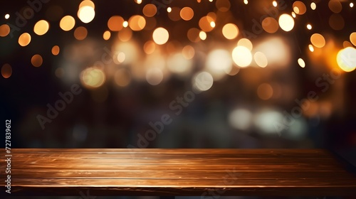 a wooden table with blurry lights in the background