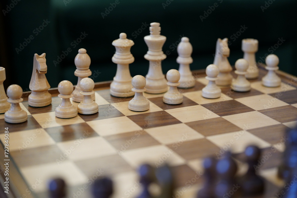 Wooden chess set being assembled for a game Wooden chess set being assembled for a game