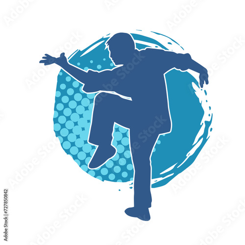 Silhouette of a man in oriental martial art pose. Silhouette of a male in martial art move.