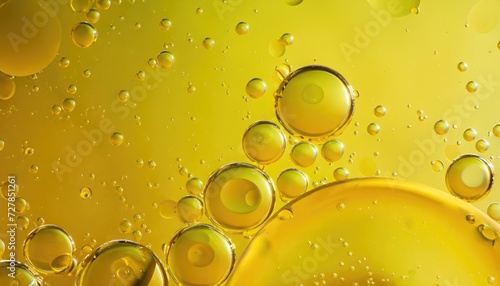 Abstract yellow background with water bubbles from oil and fat solvent