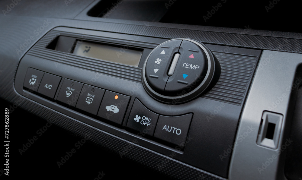 Air conditioner in a modern car, closeup of the buttons. After some edits.
