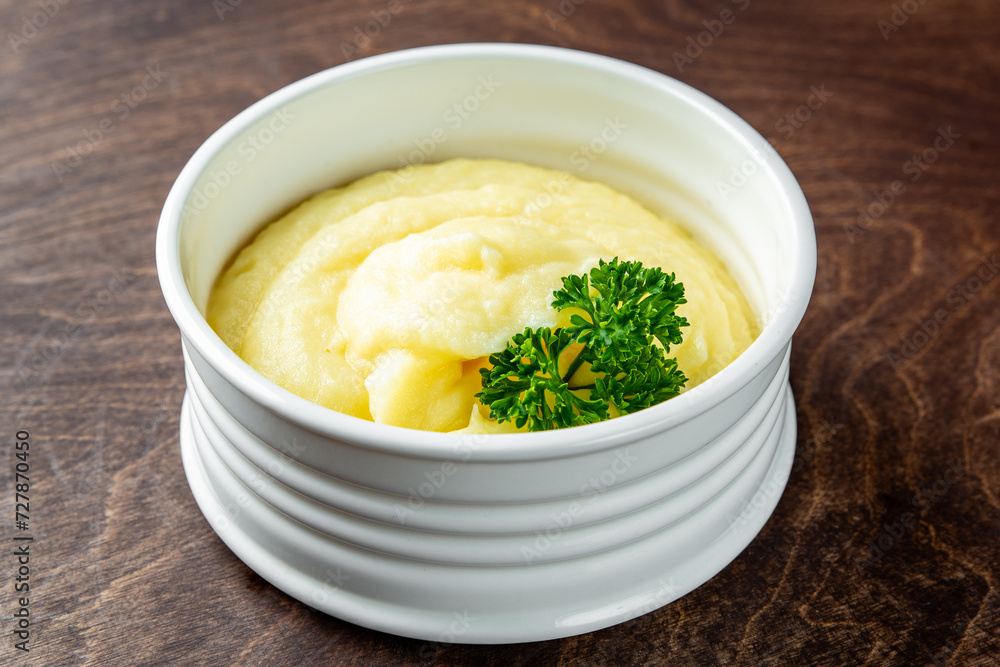 Fresh creamy mashed potato in white bowl on table Fresh creamy mashed potato in white bowl on table