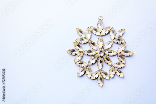 Christmas ornament on bright paper background. Soft focus. Top view. Copy space. 