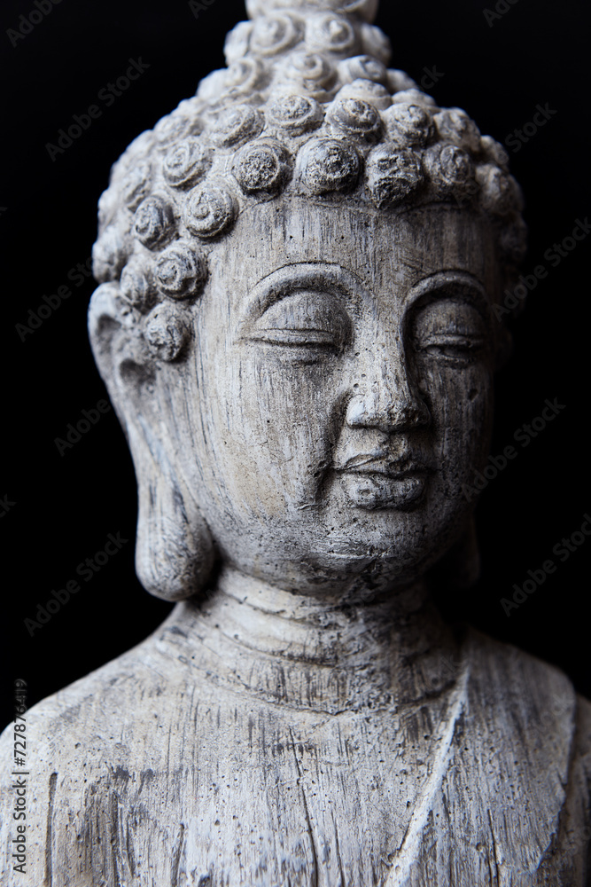 Meditating Buddha Statue on dark background. Soft focus. Close up. Copy space. Meditating Buddha Statue on dark background. Soft focus. Close up. Copy space.