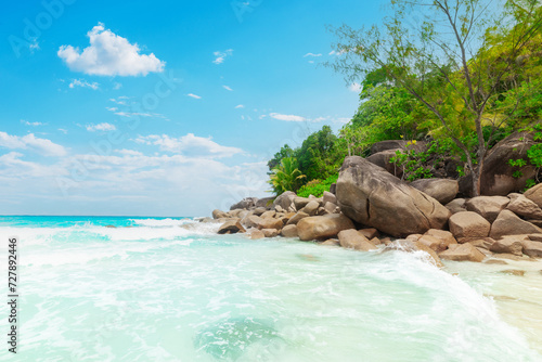 Turquoise sea and rocks in a tropical beach