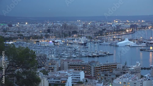 Zoom out panorama of Palma de Mallorca harbor on dusk photo