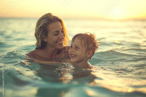 mother and child swimming in the sea © ReisMedia