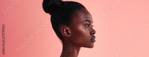 Powerful Profile of Woman on Soft Pink Background