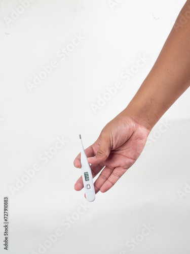 hand holding thermometer white background