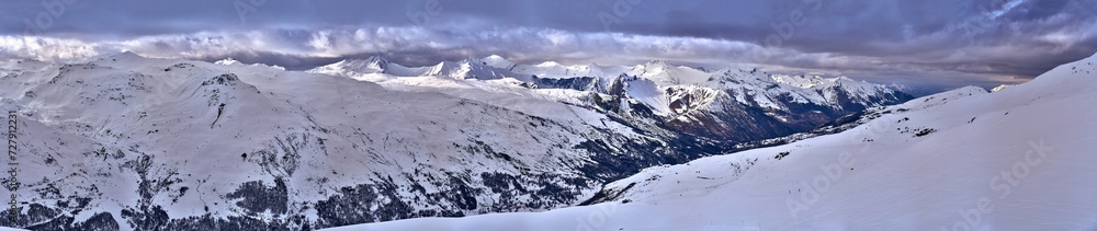 Breathtaking beautiful panoramic view on Snow Alps - snow-capped winter mountain peaks around French Alps mountains, The Three Valleys: Courchevel, Val Thorens, Meribel (Les Trois Vallees), France Breathtaking beautiful panoramic view on Snow Alps - snow-capped winter mountain peaks around French Alps mountains, The Three Valleys: Courchevel, Val Thorens, Meribel (Les Trois Vallees), France
