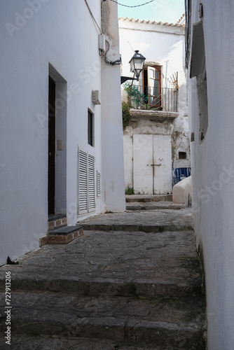 Romantic backstreet, side street and alleys in historic old town of Ibiza Stadt, Balearic Island with historic Mediterranean style architecture facades, a landmark sightseeing tourist spot in downtown