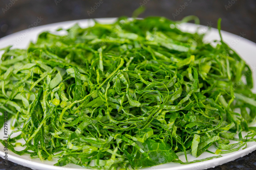 Kale leaves chopped and sliced into thin strips Kale leaves chopped and sliced into thin strips