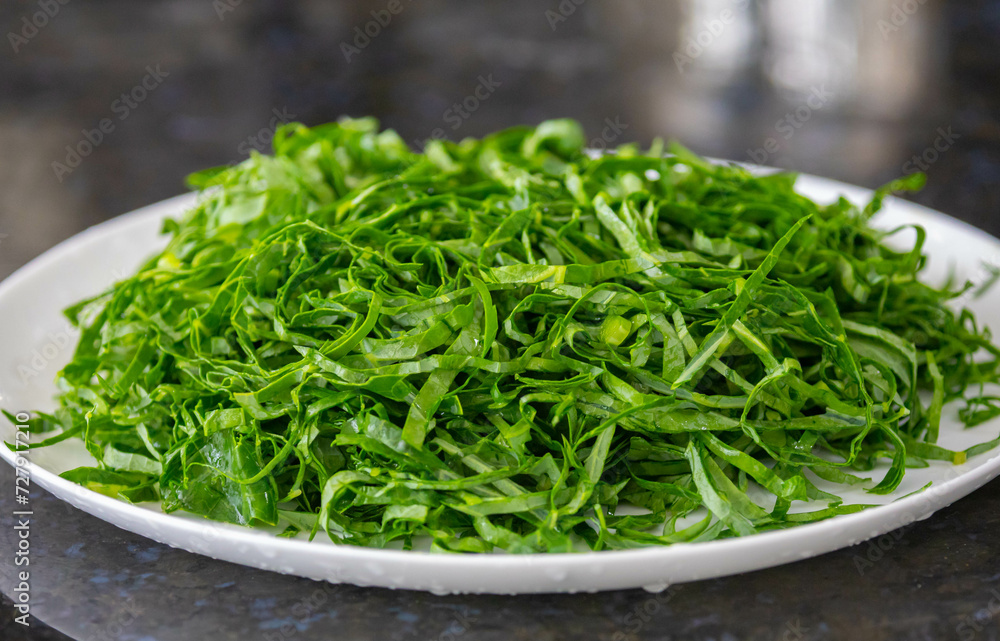 Kale leaves chopped and sliced into thin strips Kale leaves chopped and sliced into thin strips