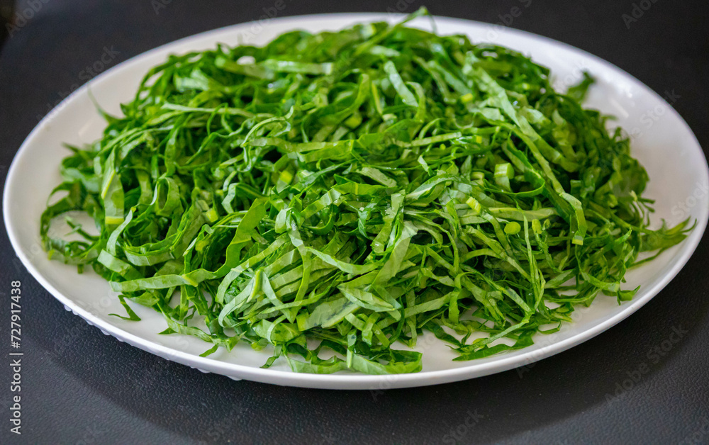 Kale leaves chopped and sliced into thin strips Kale leaves chopped and sliced into thin strips