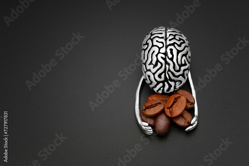 Фотография Caffeine Embrace: Human Brain Grasping Roasted Coffee Beans