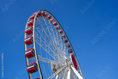 Ferris wheel against blue sky.