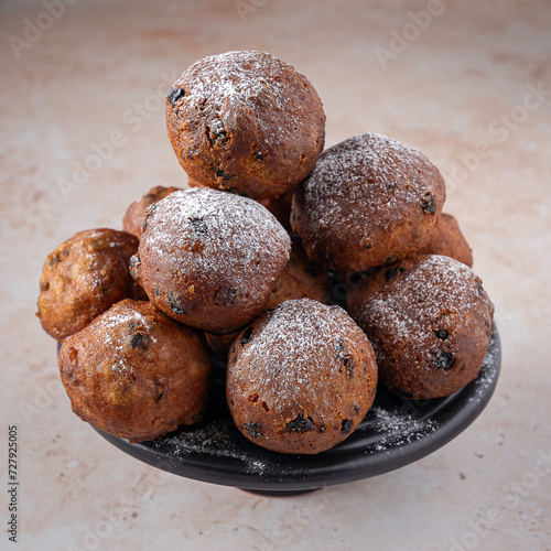 Traditional Dutch oliebollen on light background, served on New Years Eve