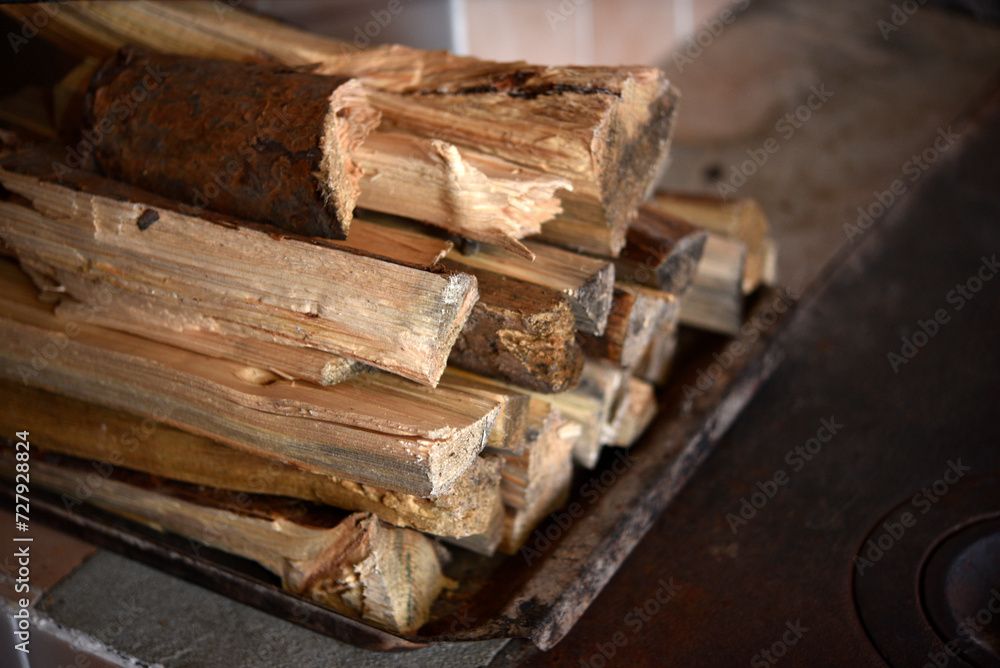 Chopped firewood. Wooden firewood for kindling the stove. Wood fuel. Chopped firewood. Wooden firewood for kindling the stove. Wood fuel.