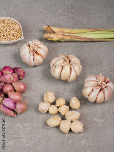 details from above
 herbs and spices
seen from above the spices on the cast table, lemongrass, shallots, garlic