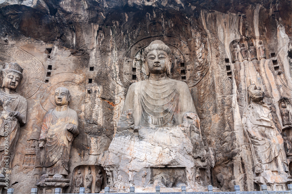Buddhist statues in Longmen Grottoes. China. This large grotto group was started from 494 AC finished about 644 AC.