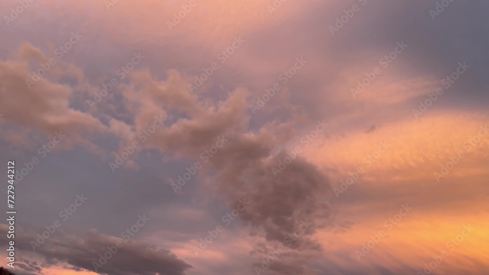 Beautiful sunset sky with clouds over Carpathian mountain forest