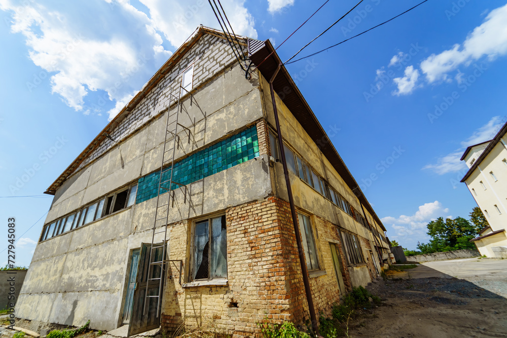 Outdoor abandoned factory house. Old exterior construction. Outdoor abandoned factory house. Old exterior construction.
