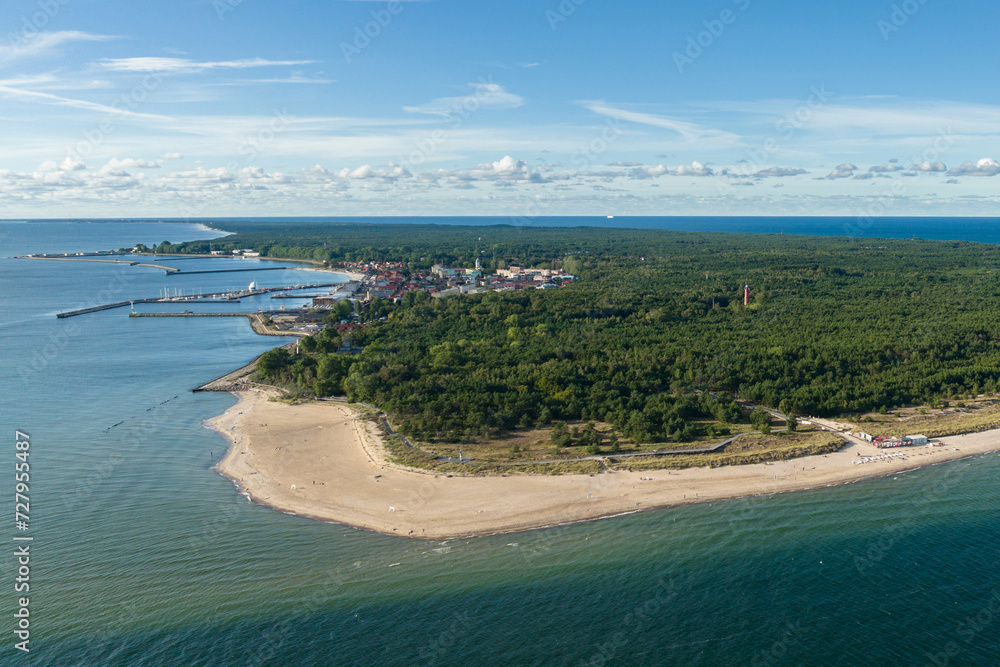 Naklejka premium Hel city. Aerial view of Hel Peninsula in Poland, Baltic Sea and Puck Bay (Zatoka Pucka) Photo made by drone from above. End of poland hel peninsula. Hel beach in Poland