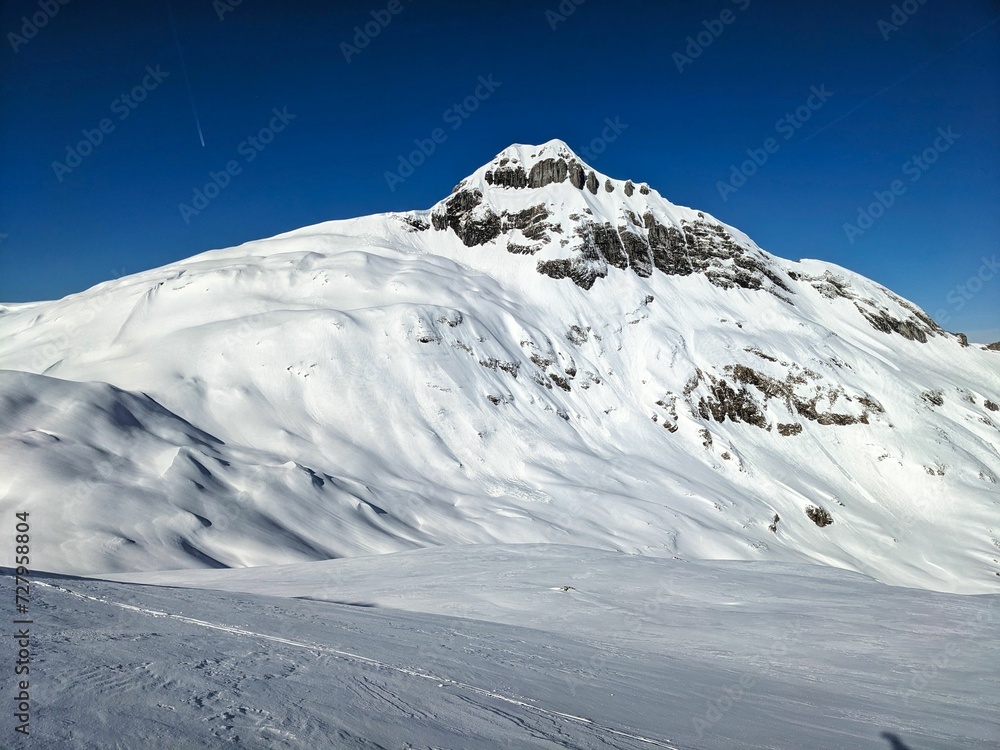 Ski tour on the Pfannenstock mountain in the Schwyz Alps. Backcountry tour in Glarus in a beautiful mountain landscape. Ski mountaineering in Braunwald. Skitouring . High quality photo.