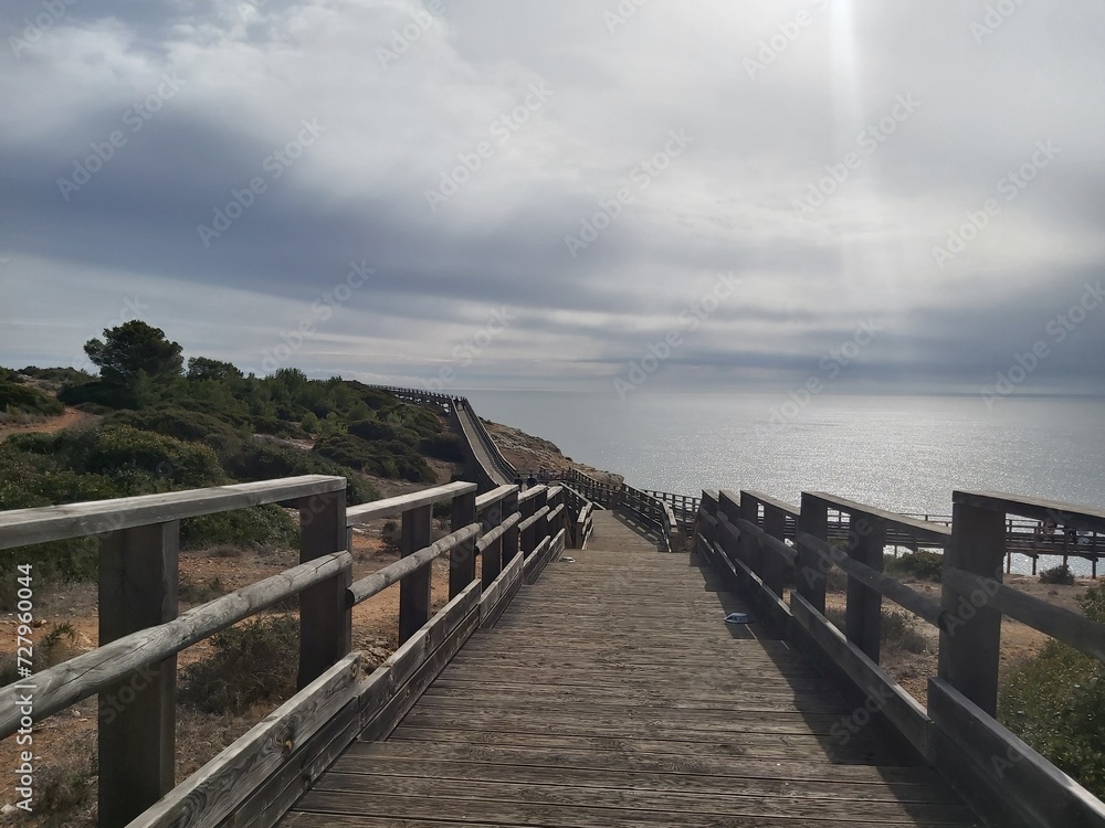 wooden bridge over the sea