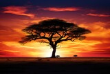 A stunning tree stands tall in the middle of a vast field, surrounded by the warm hues of a breathtaking sunset, The silhouette of a lone tree on an African savanna, AI Generated