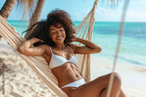 Summer travel vacation concept, Happy traveler african American woman with white bikini relax in hammock on beach © Iulia