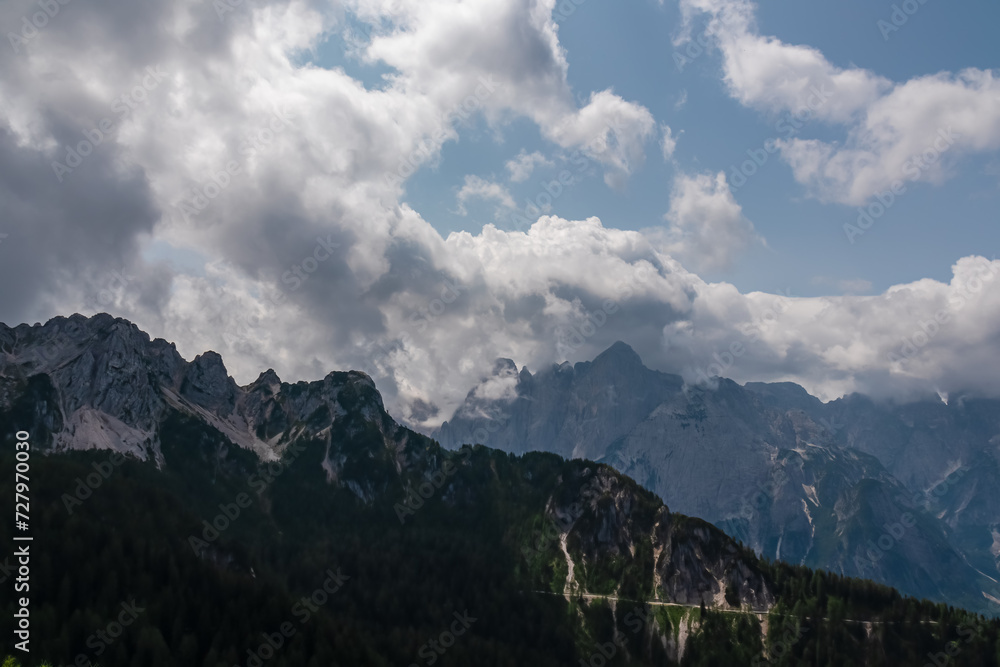 Scenic view of mountain peak Jof Fuart in untamed Julian Alps seen from summit Cima del Cacciatore, Monte Santo di Lussari, Friuli-Venezia Giulia, Italy. Wanderlust in remote Italian Alps in summer