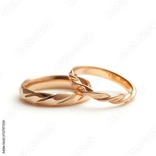 A Close-up View of Two Wedding Rings on a White Background, Bathed in Soft Illumination