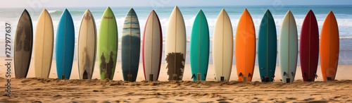 Surfboards on a sandy beach with palm trees in the background. Surfboards on the beach. Vacation Concept with Copy Space. © John Martin