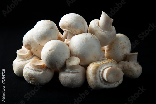 Mushrooms on a black background.Sale of mushrooms and champignons.