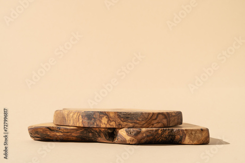 Fototapeta Naklejka Na Ścianę i Meble -  Rustic board stand. Background for products cosmetics, food or jewelry. Rustic wood pieces podium. Front view.	