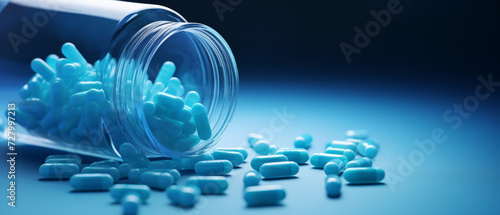 Spilled Capsules from an Open Transparent Bottle on a Light Blue Background with a Soft Glow
