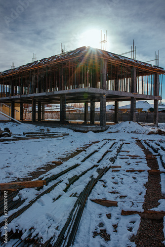 House under construction in winter sunny day