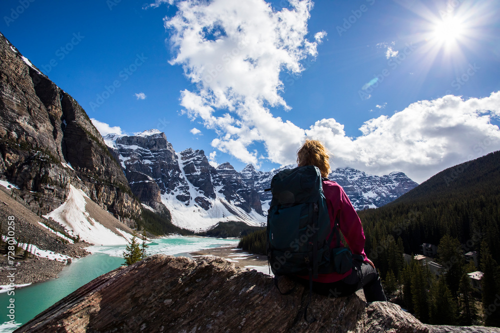Young woman in Moraine lake, Banff National Park, Canada Young woman in Moraine lake, Banff National Park, Canada
