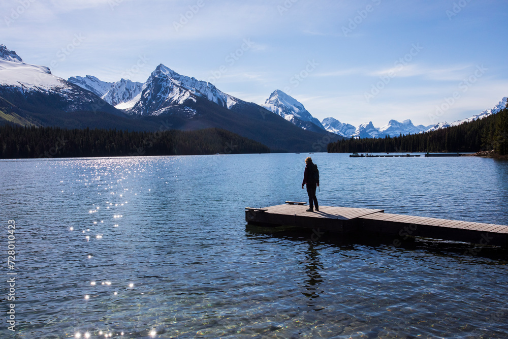 Summer landscape and people kayaking and fishing in Maligne lake, Jasper National Park, Canada