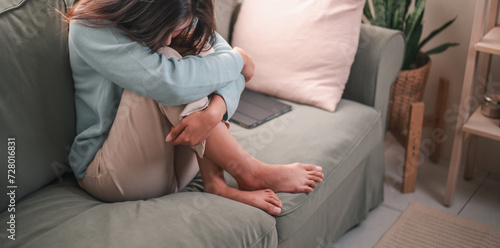 sad, depression, unhappy, depressed, lonely, problem, upset, alone, sofa, bad. depressed young woman sitting on couch in home, frustrated confused female feels unhappy problem in personal life.
