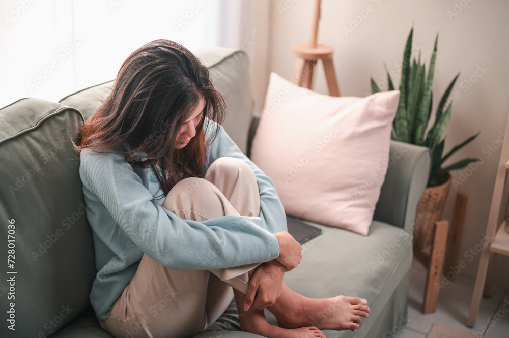 sad, depression, unhappy, depressed, lonely, problem, upset, alone, sofa, bad. depressed young woman sitting on couch in home, frustrated confused female feels unhappy problem in personal life. sad, depression, unhappy, depressed, lonely, problem, upset, alone, sofa, bad. depressed young woman sitting on couch in home, frustrated confused female feels unhappy problem in personal life.