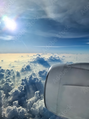 View from an airplane of the engine and the clouds over the Maldives.